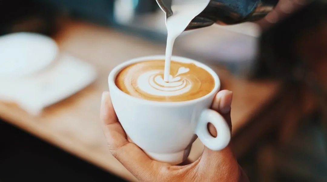 Latte art being poured